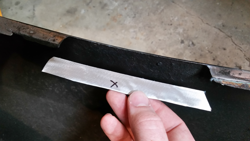 One of two trapezoidal patches. Another can be seen in-situ on the left; after welding a slight return was bent into their overhang to add further stiffness and match the original layout